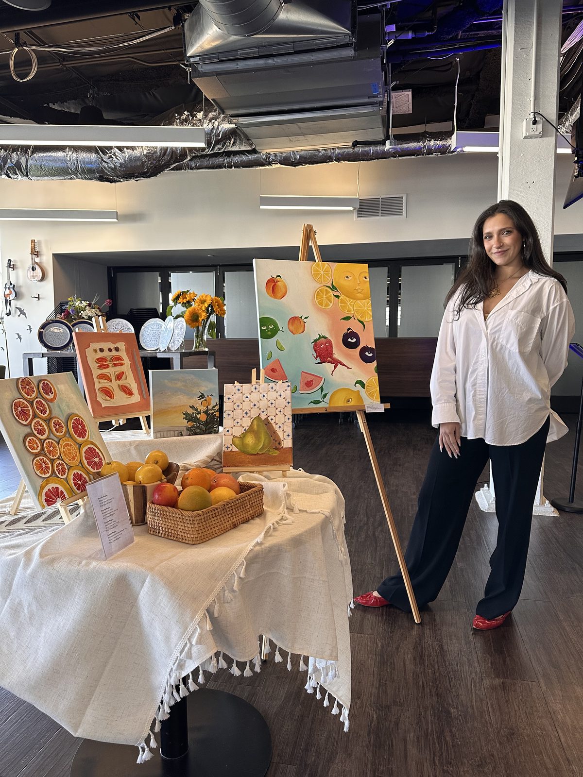 Brooke Rapko with her painting collection
