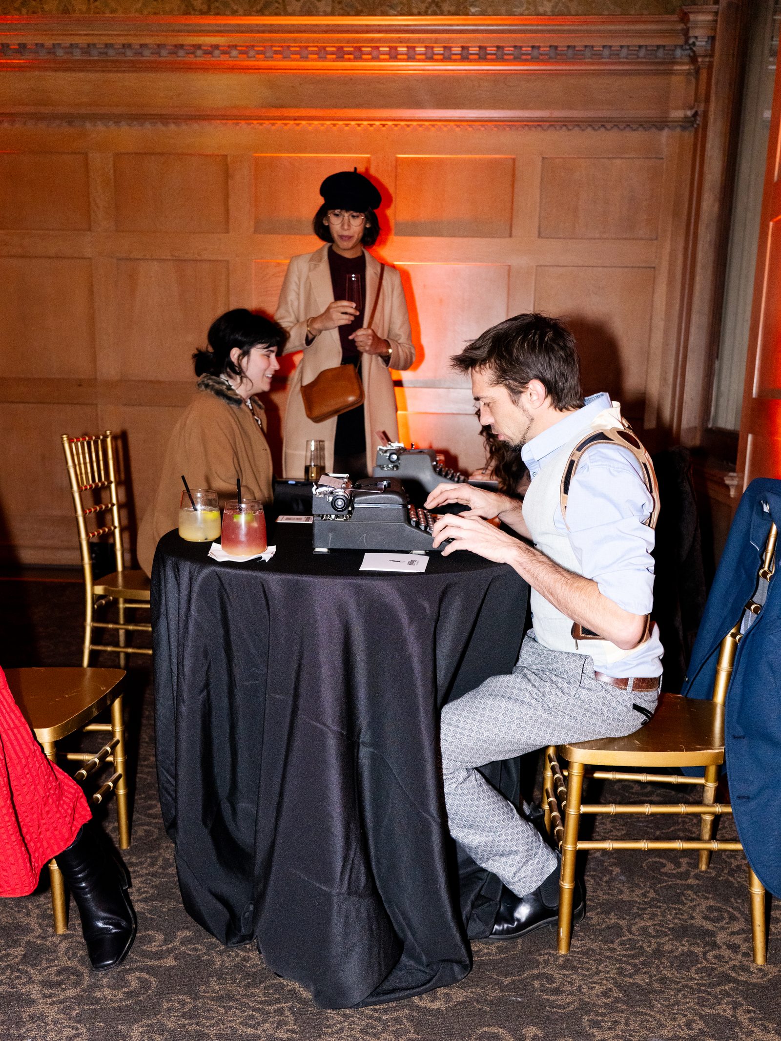 Guests at the vintage typewriter poetry table